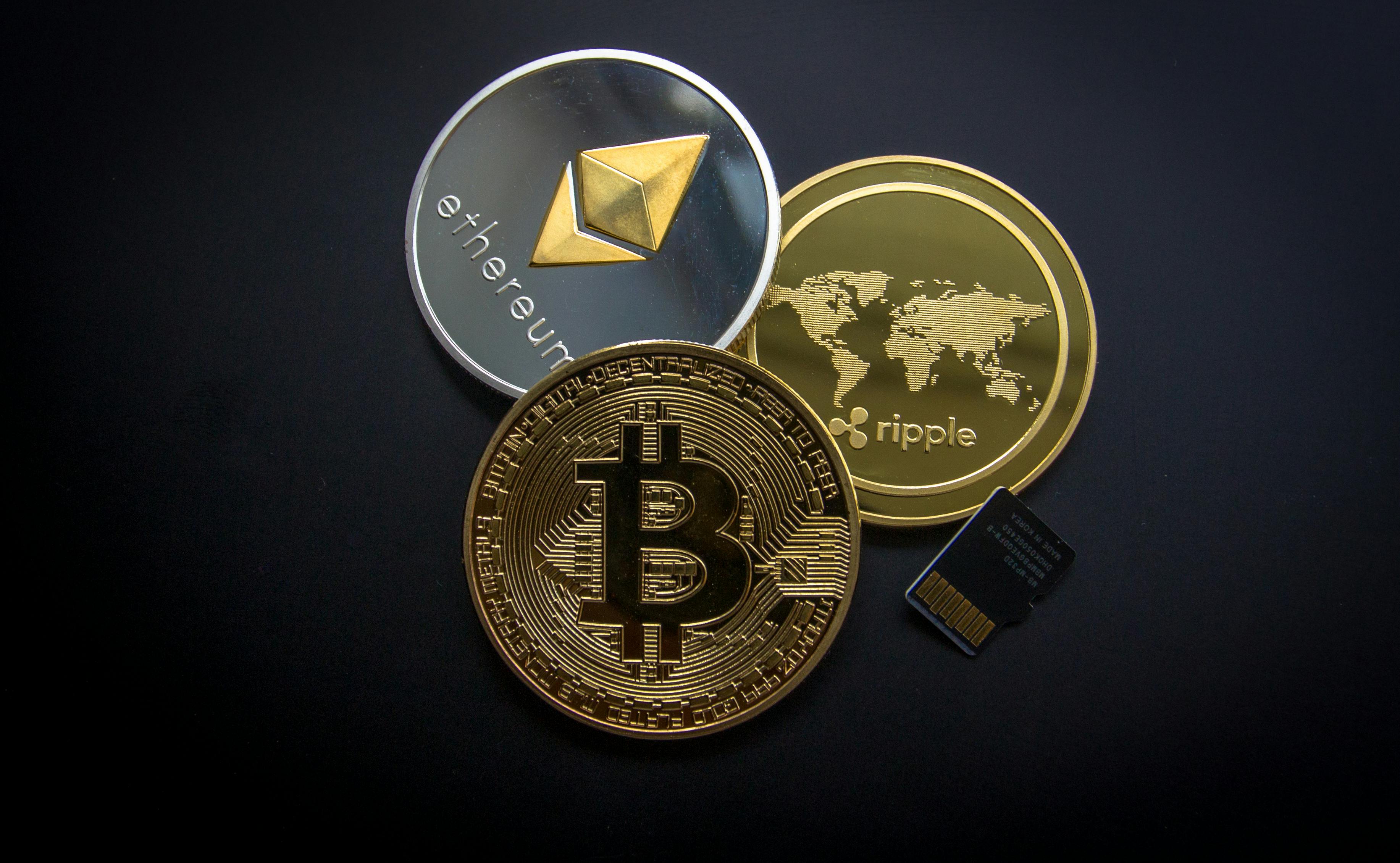 3 coins with the symbols of Bitcoin, Ethereum and Ripple